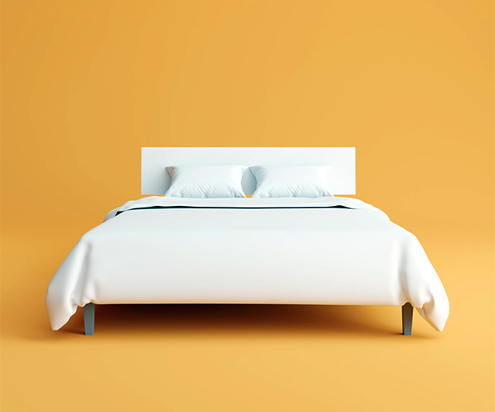 cama de matrimonio sobre fondo naranja