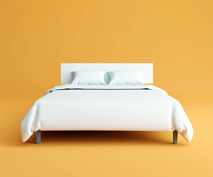 cama de matrimonio sobre fondo naranja